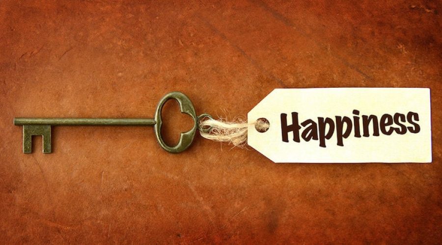 old key with tag reading "happiness"