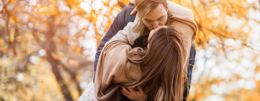 Man holding woman for a kiss