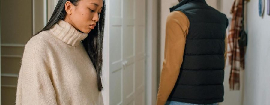 couple looking disconnected facing opposite ways