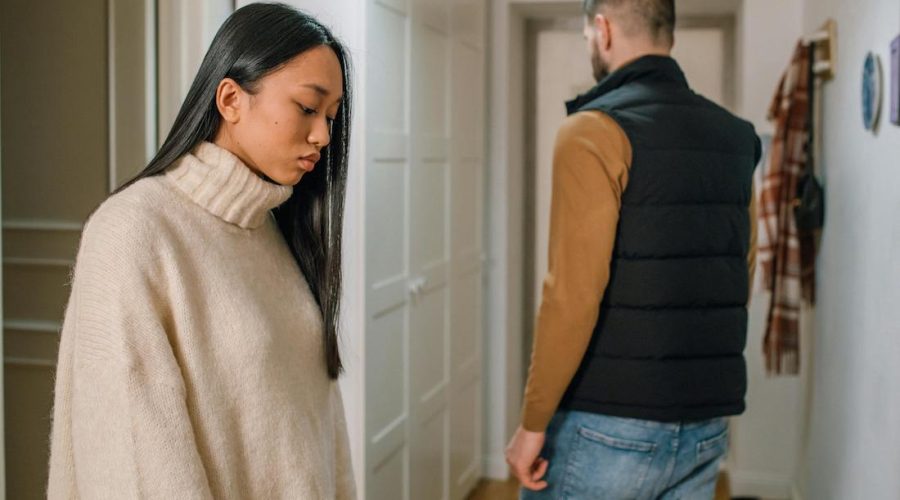 couple looking disconnected facing opposite ways